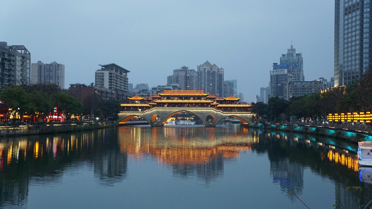 Anshun Bridge lit up at dusk over the Jin River in Chengdu, Sichuan