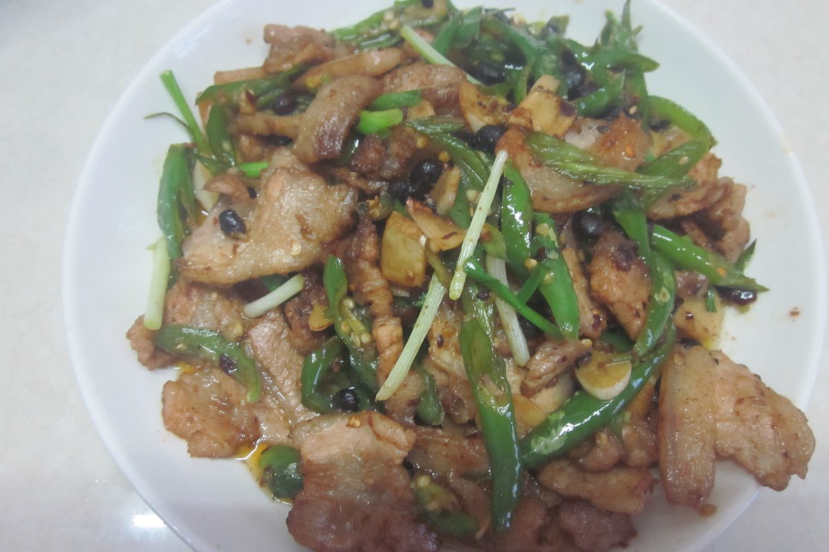 Hunan-style twice-cooked pork stir-fried with green chillies, spring onions and fermented black beans