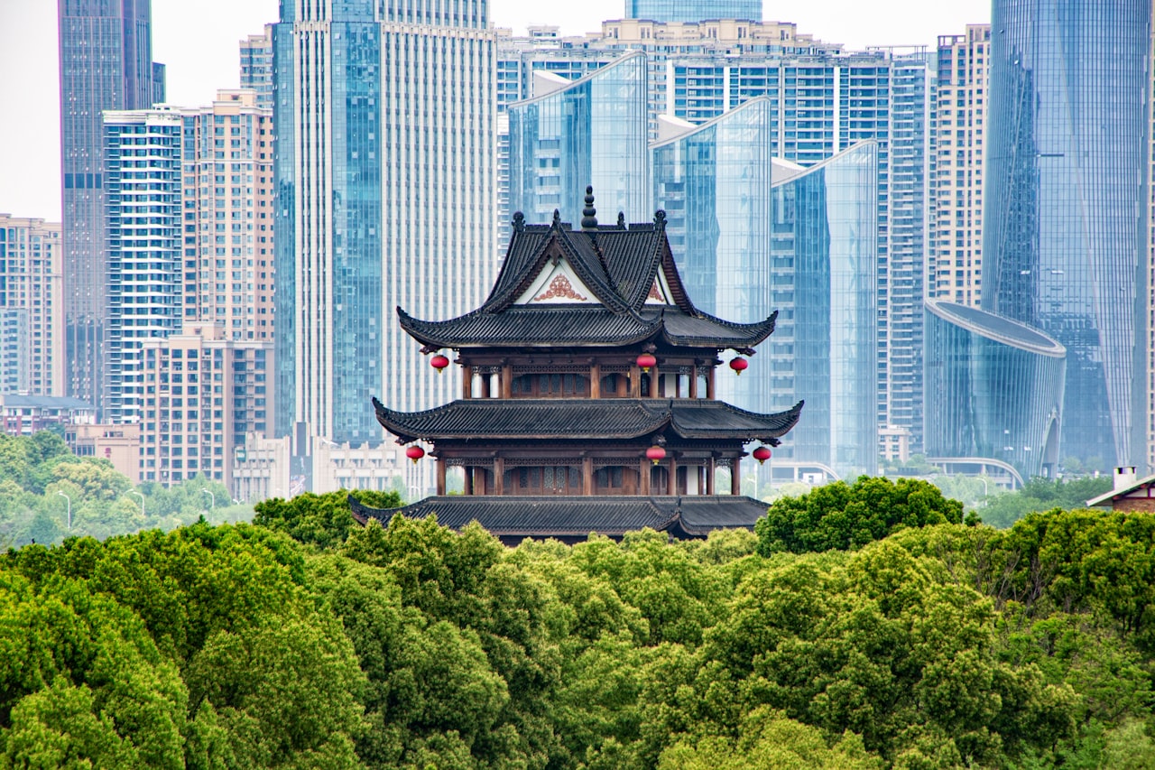 Skyscraper rising above forested parkland in Changsha, Hunan
