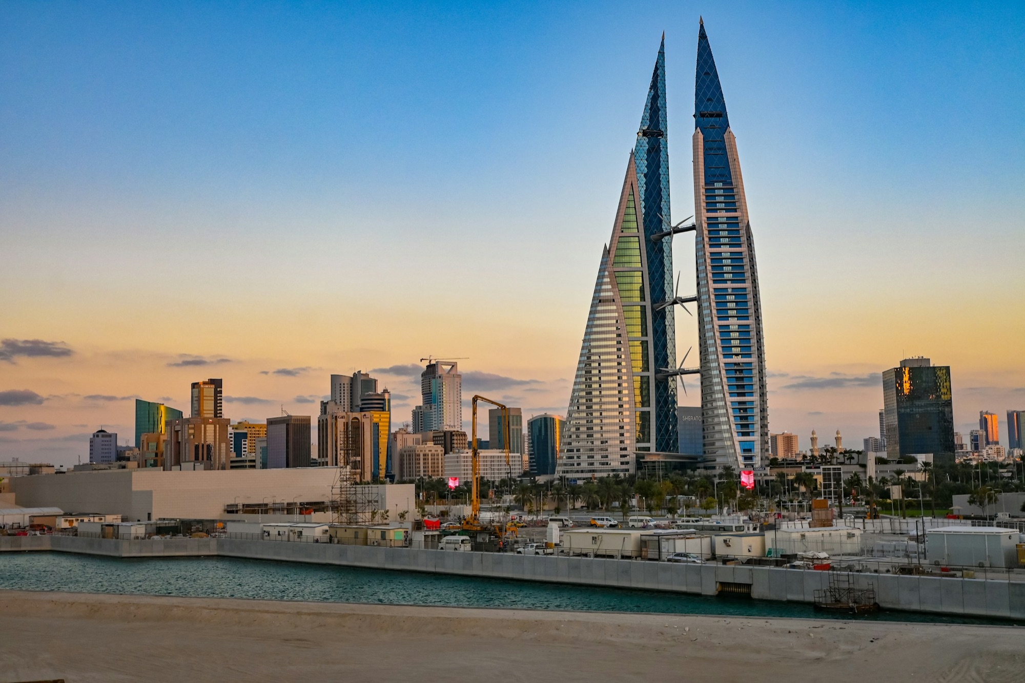 The Manama skyline with the Bahrain World Trade Center at sunrise — online Mandarin lessons with WillyChina