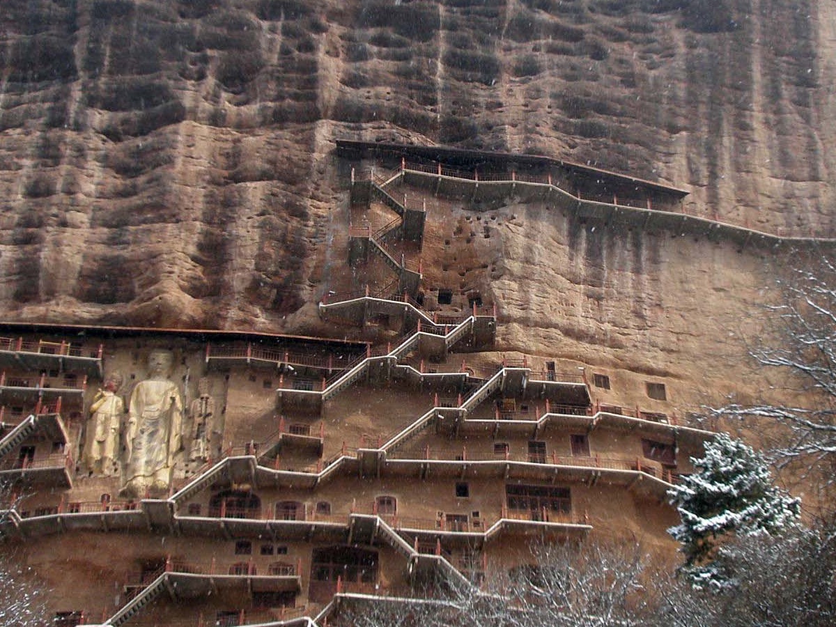 Wooden walkways and Buddha statues carved into the cliff face of Maijishan Grottoes, Tianshui, Gansu