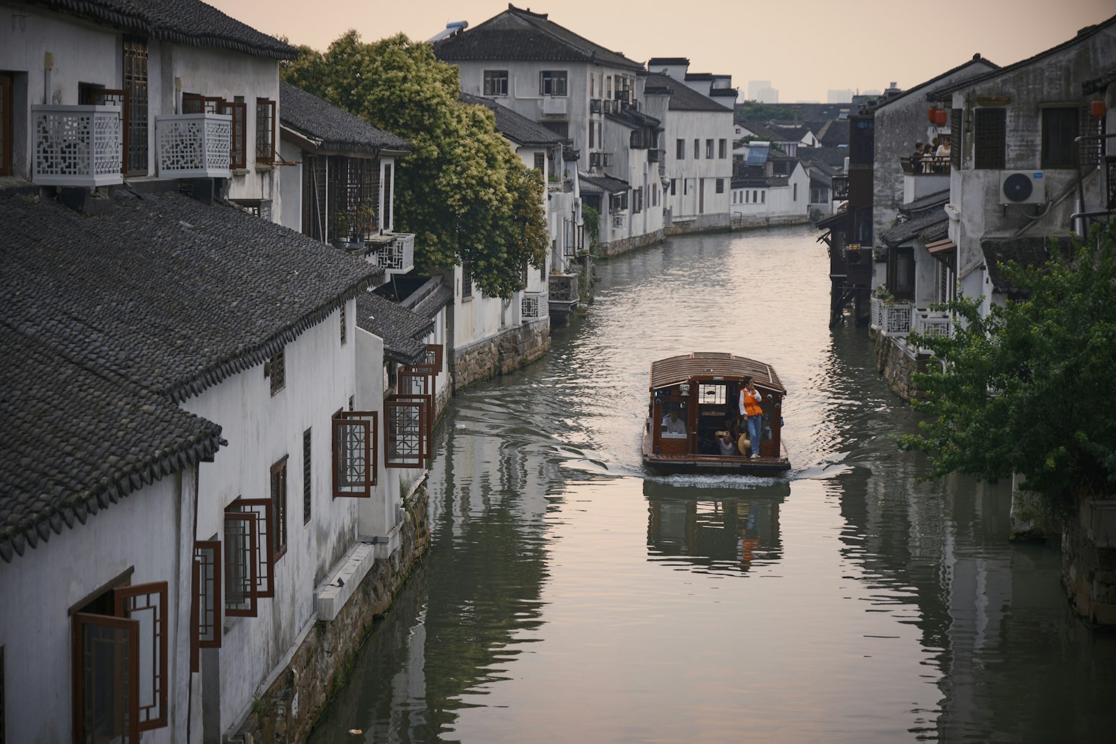 Traditional canal houses reflected in still water, Jiangsu, China