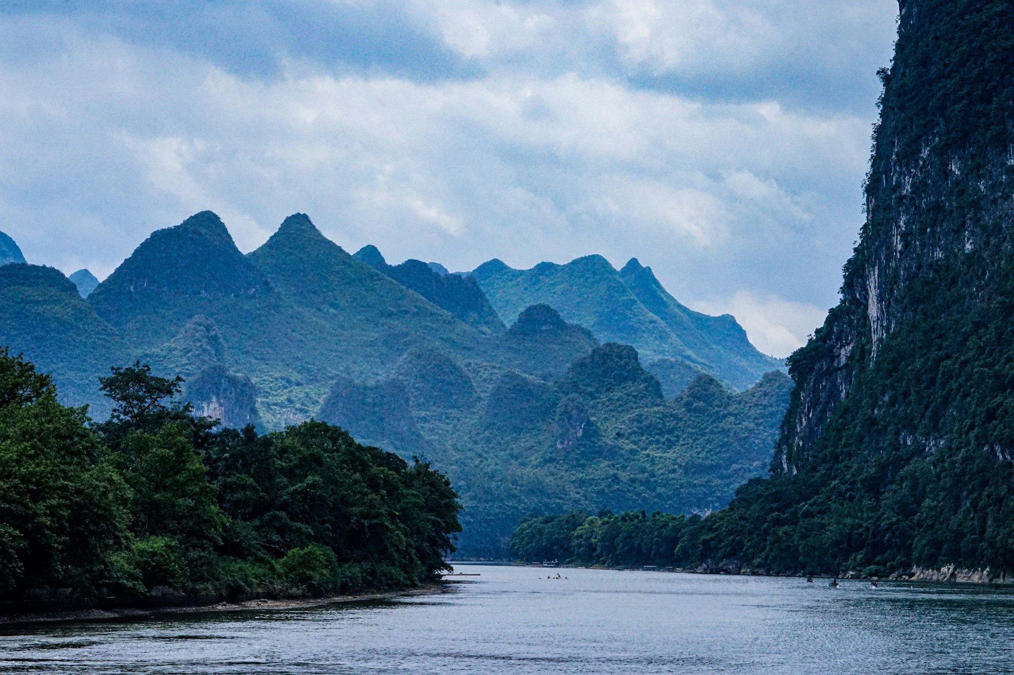 Karst mountains reflected in the calm Li River, Guangxi, China
