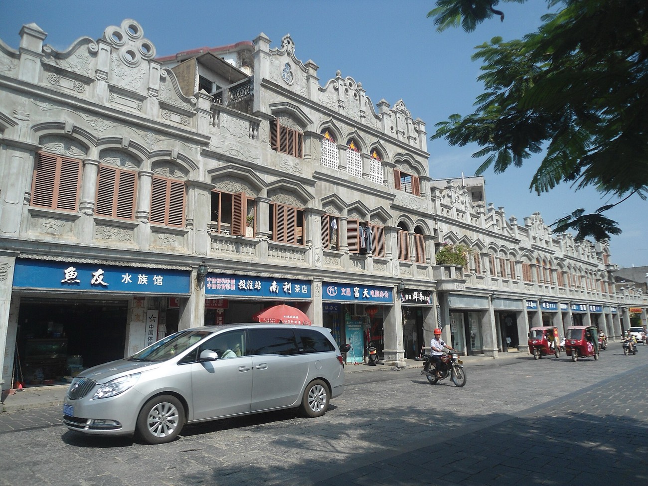 Ornate arcaded qilou shophouses lining an old street in Wenchang, Hainan
