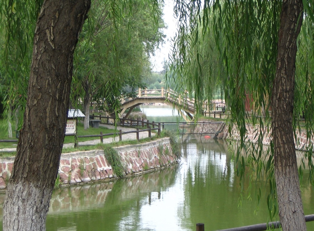 Song-dynasty pavilions and a stone bridge at the Millennium City Park, Kaifeng, Henan