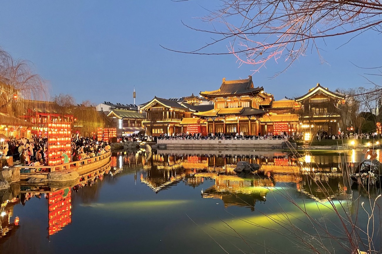 The reconstructed Luoyi Ancient City old town illuminated at night, Luoyang, Henan