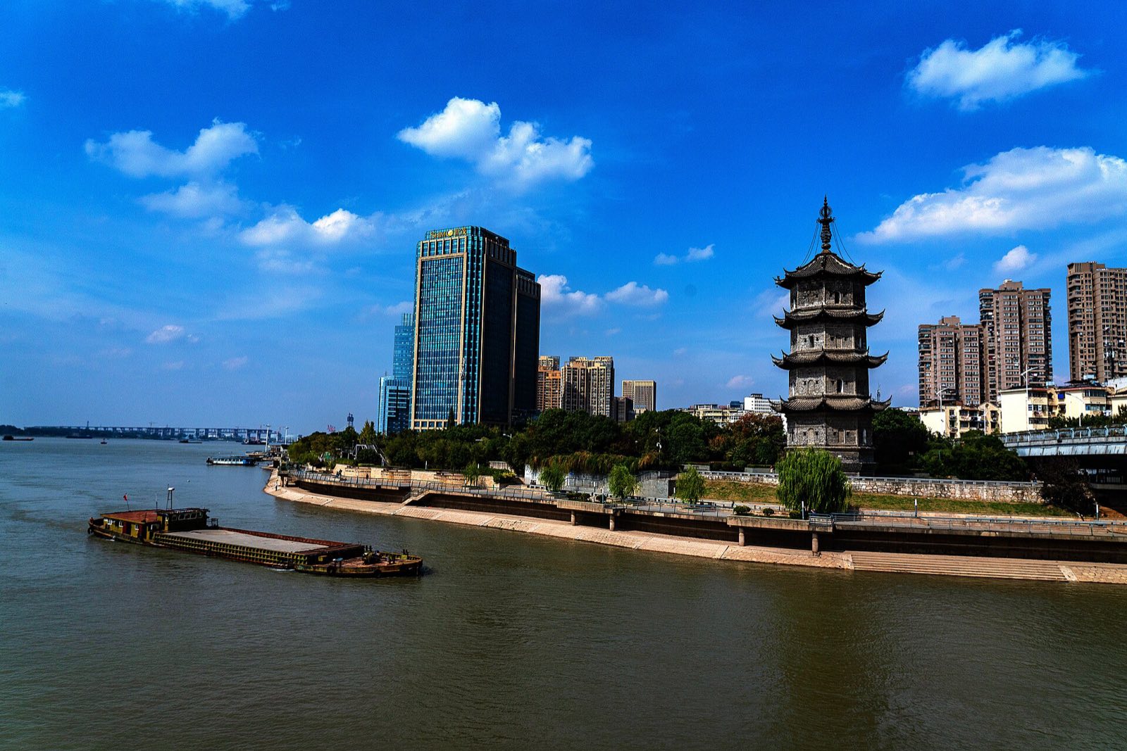 Zhongjiang Pagoda where the Qingyi River meets the Yangtze at Wuhu, with the city skyline behind
